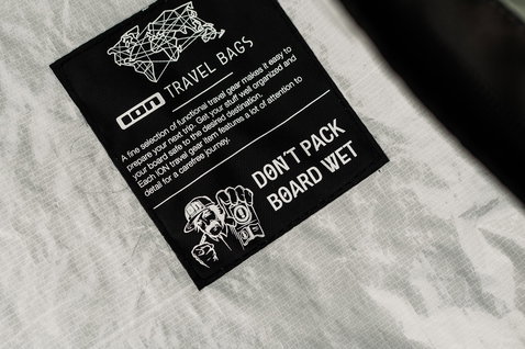 ION Gearbag Core kite travel bag interior detail with brand label in light grey and black
