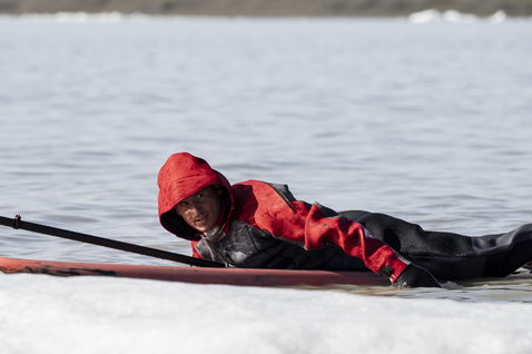 ION Fuse Drysuit 4/3mm back-zip drysuit in black and red during wave riding in Iceland