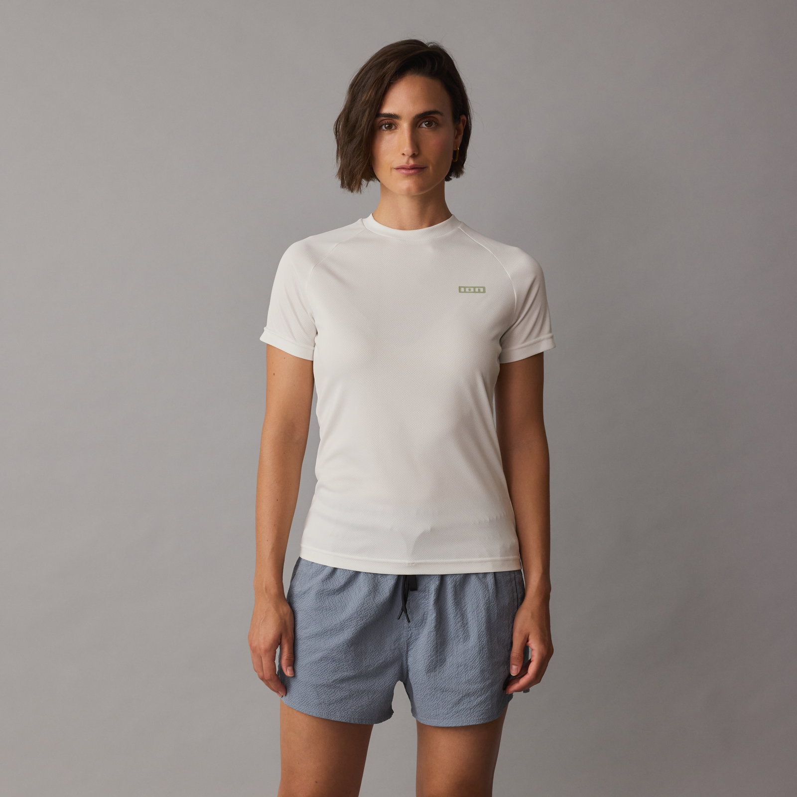 ION Wetshirt short-sleeve women's rash guard in off-white with sage green logo