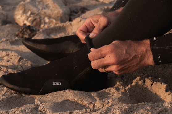 Neoprene Sock Ballistic 3/2 Round Toe shown being put on.