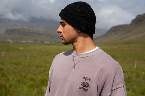 ION Mood men's crewneck sweater in driftwood with embroidery worn outdoors