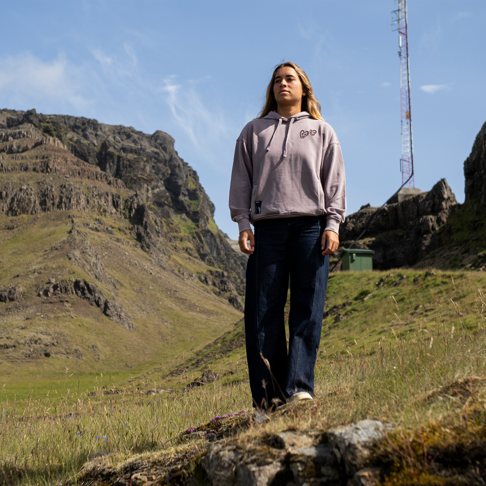 ION Water No Bad Days women's hoodie in greige during outdoor adventure in highland landscape