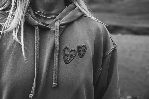 ION No Bad Days women hoodie with embroidered heart motif worn outdoors