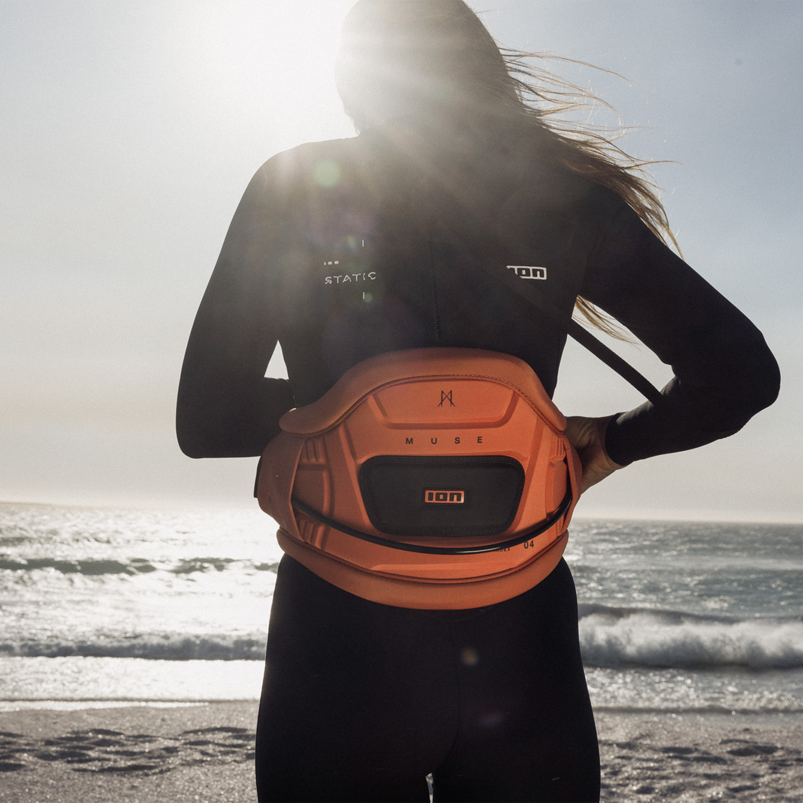 ION Muse waist harness during kitesurfing at the beach in coral