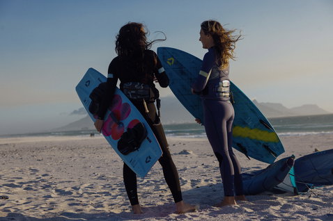 ION Sol Curv seat harness during kitesurfing on the beach at golden hour