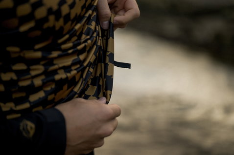 ION Maze long-sleeve rashguard men in black and ochre — detail view of geometric maze print pattern