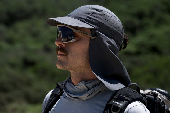 ION Water Cap Surf Cap PRO sun cap with neck flap in slate grey worn outdoors