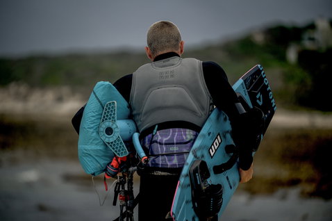 ION Vector Core impact vest during kitesurfing at the coast