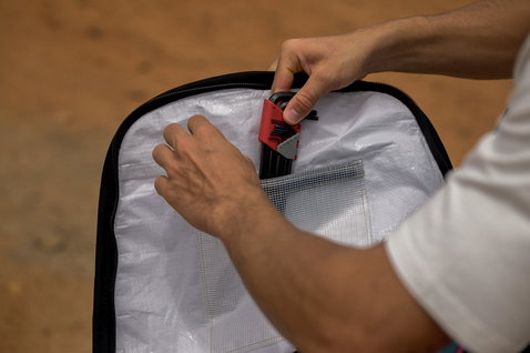 ION Core twintip boardbag open showing recycled interior with mesh accessory pocket
