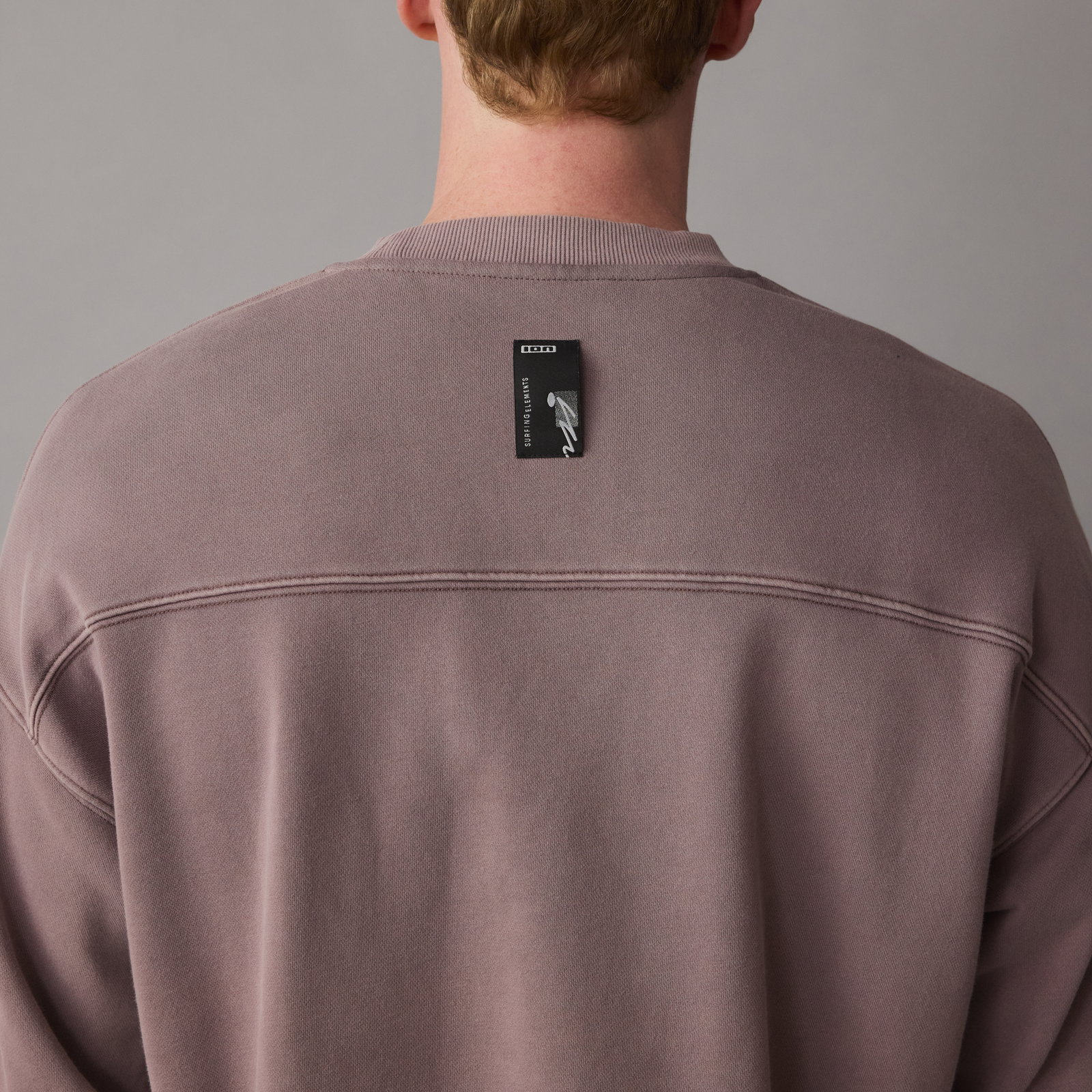 ION Mood men's sweater in driftwood — back detail showing yoke seam and ION label