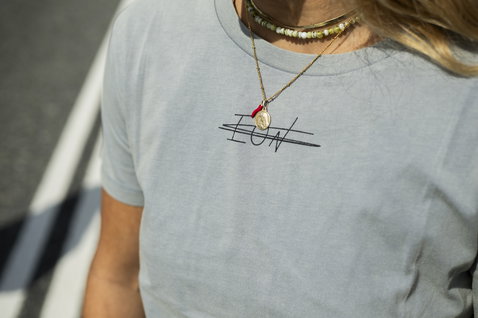 ION Tee Graphic SS women's t-shirt in light grey with ION logo print, worn by a model