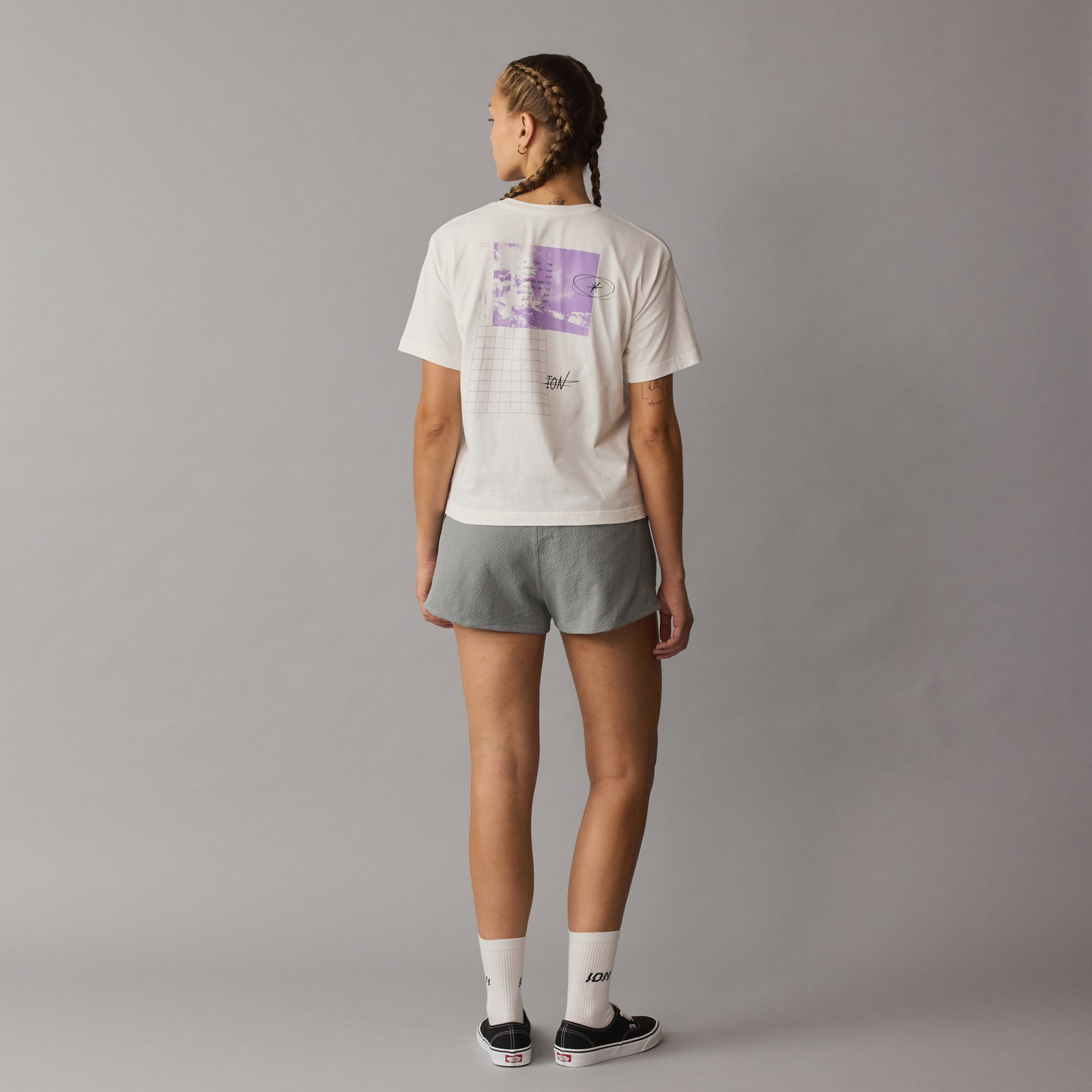 ION Vibes short sleeve tee women in off-white with lavender back graphic print