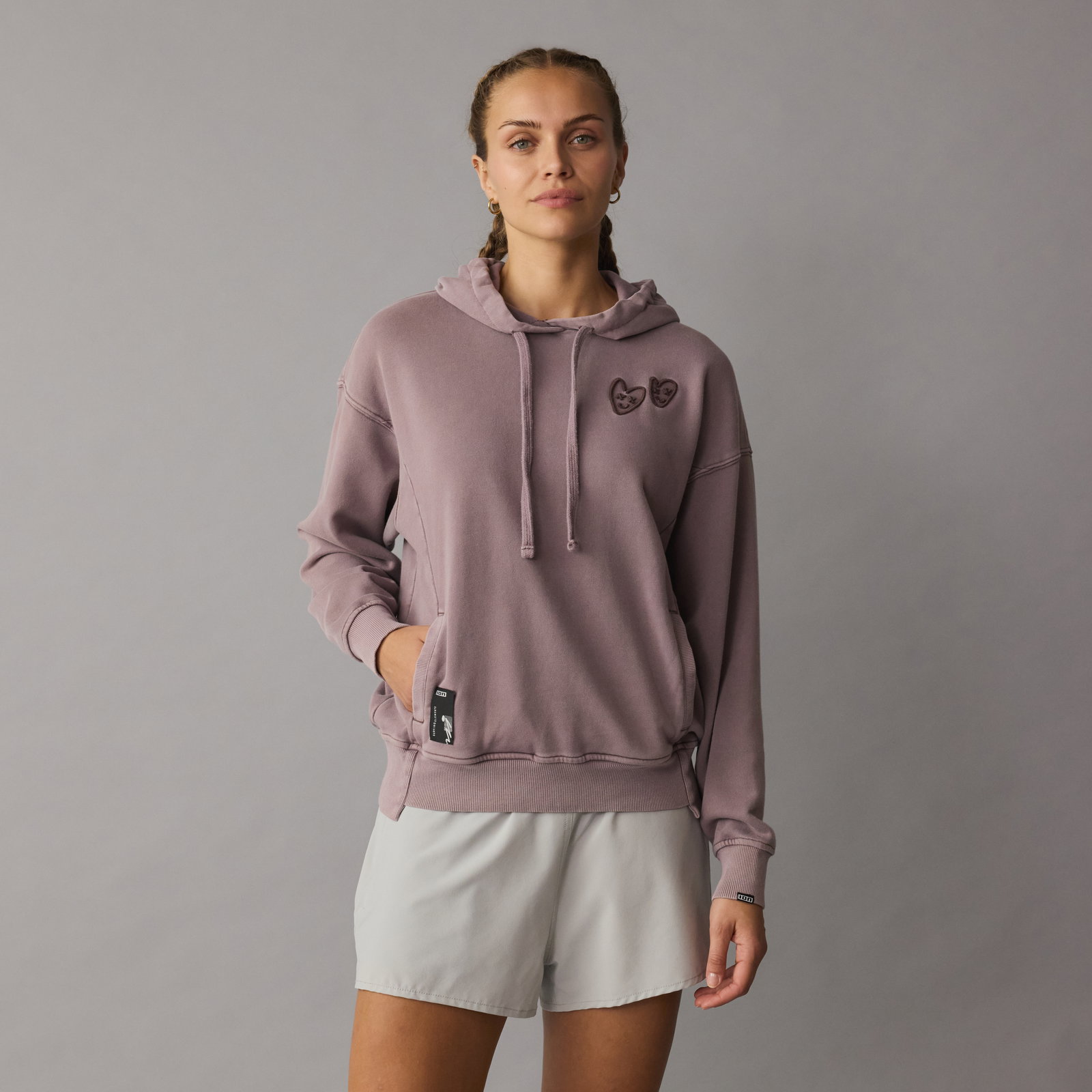 ION No Bad Days women's pullover hoodie in dusty mauve, front view on model