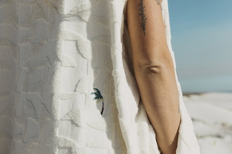 ION Poncho Select Reefside surf poncho in off-white worn at the beach