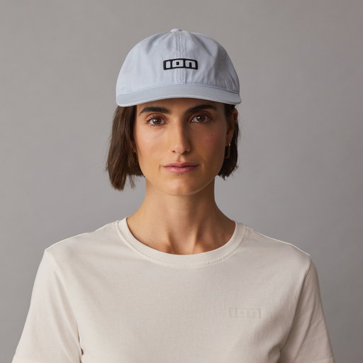 ION Session cap in light blue with black embroidered logo, worn on model in studio