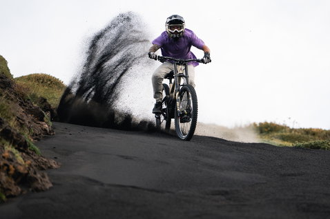 ION Bike Ionic SS DR Lyocell short-sleeve jersey in lavender during mountain biking on volcanic trail