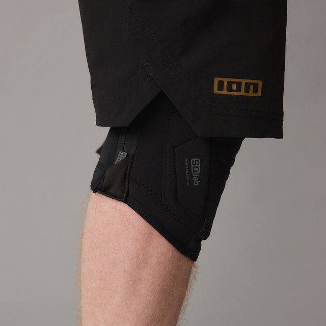 ION K-Pact Zip SQlab knee pads in black, side on-model view showing E-zipper closure