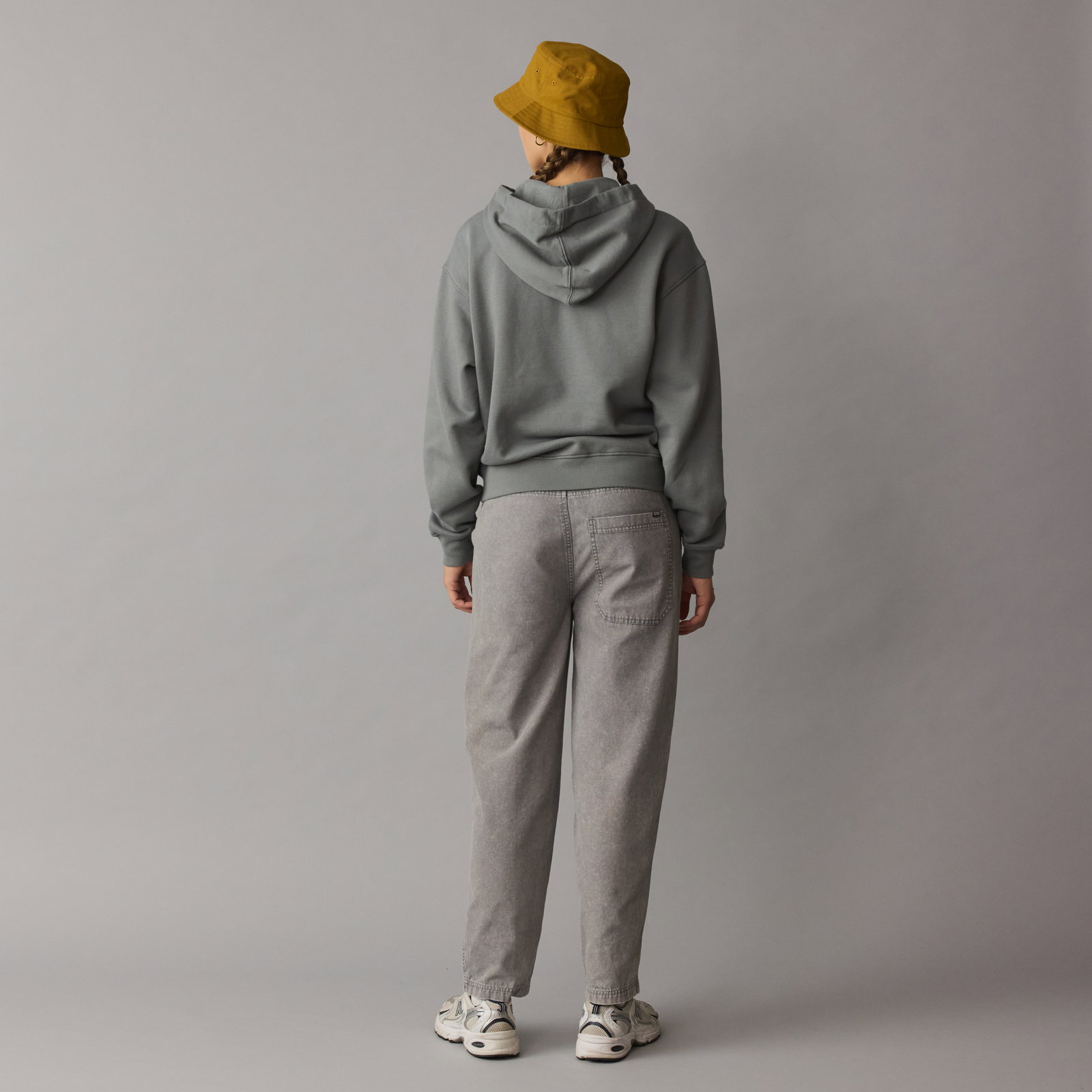 ION IONIC women's hoodie in sage with drop shoulders and drawstring hood, back view on model