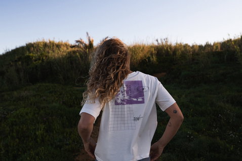 ION Tee Vibes SS women's T-shirt in off-white with graphic print worn at the coast