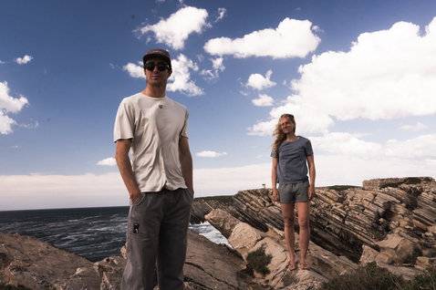 ION Tee Graphic SS men's short sleeve t-shirt in off-white worn on coastal cliffs