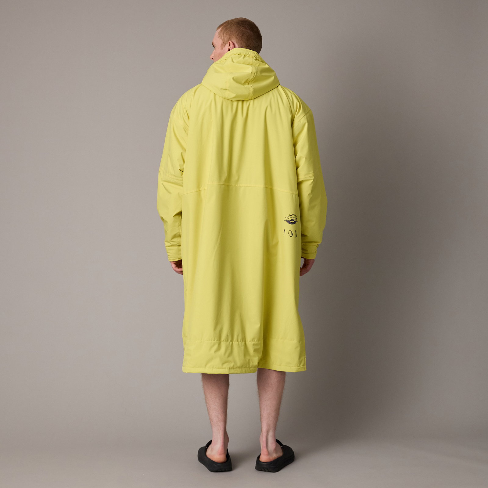 ION Storm Coat water jacket unisex in lime yellow, back view on model