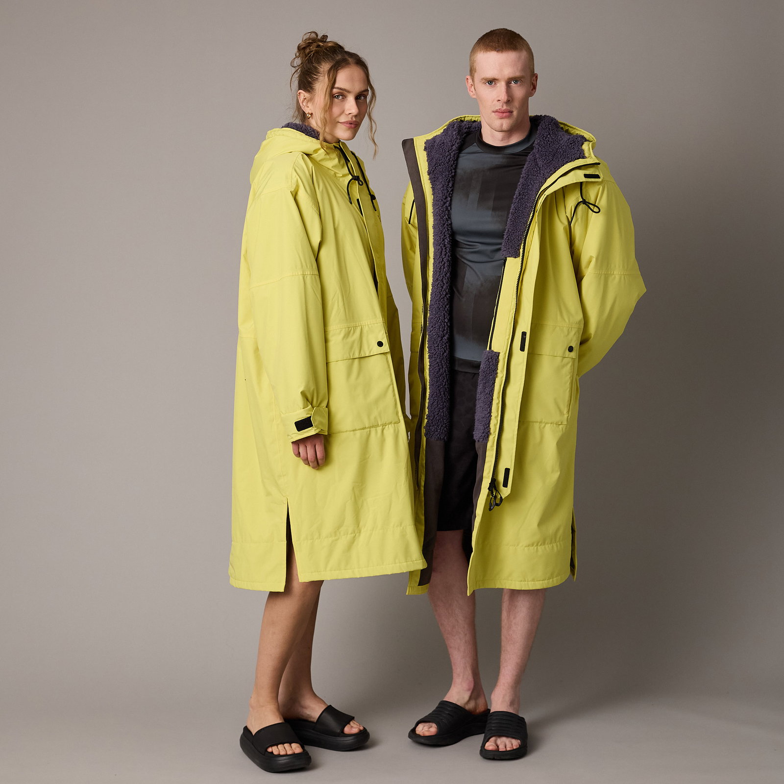ION Water Storm Coat unisex water jacket in lime yellow with sherpa fleece lining, worn by two models