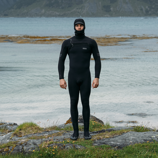 ION Seek Amp 6/5mm front-zip hooded fullsuit wetsuit men in black during surfing at the coast