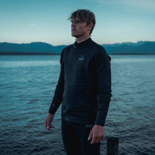 ION Surf Shield long-sleeve rashguard unisex in dark navy worn during watersports at the lakeside