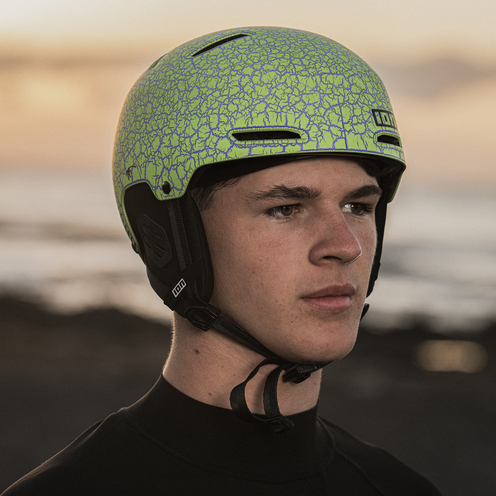 ION Slash Amp helmet in marble lime during kitesurfing at the coast