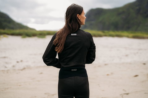 ION Surf Shield bottom tights short wetsuit top in black during wave riding at the coast