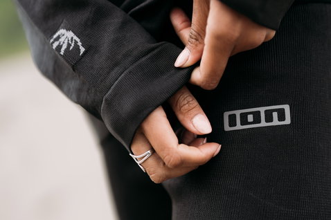 ION Bottom Tights Surf Shield unisex in black, detail shot showing ION logo at hip